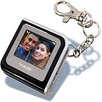 With a black finish and silver trim, this little keychain has a lot to boast. The TAO Digital Picture Frame Keychain is an elegantly styled portable photo viewer that allows you to store and view your favorite digital pictures. This advanced device allows you to view your photos anywhere. A key to happiness is stealing glances of loved ones' smiles throughout your day. This keychain makes viewing digital photos of those you love fun and easy. Its unique keychain design features a 1.4" full color LCD screen and two viewing modes (manual browse and slideshow). Along with your home and car keys you can carry up to 56 full color digital pictures of your favorite people or any other pictures you choose. Easily transfer photos to the unit's flash memory by connecting it to your PC's USB port (cable included). The internal rechargeable battery can be charged with the included AC adapter, and it has an approximate 2.5 hour battery life (continuous use). This device also includes software to let you transfer photos from your PC. Find inspiration, show off your new baby, or remember precious moments and people with the TAO Digital Picture Frame Keychain! Features: *1.4" full color backlit LCD screen on integrated keychain *Allows you to store and view up to 56 photos *Load and change photos easily *2 viewing modes - manual browse and slideshow *Transfer photos via USB connection *Truly portable, lightweight and durable