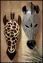 Add a tribal touch to any room with these stylized wall sculptures by Nigerian-born Okulaja, who trained at the prestigious Remo Div Art School. Hand-painted in the natural palette of Africa,