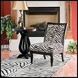 Spice up your home decor with a unique chair. Safari chair is covered in zebra print fabric. From zebra print rugs to cow print rugs to leopard print rugs or a combination of several animal prints, you'll surely find what you're looking for. Exotic animal print is captured for the contemporary home in shades of brown. Woven in France of durable, heat-set polypropylene shag pile for years of use. Jungle safari theme decorating - animal print home decor.